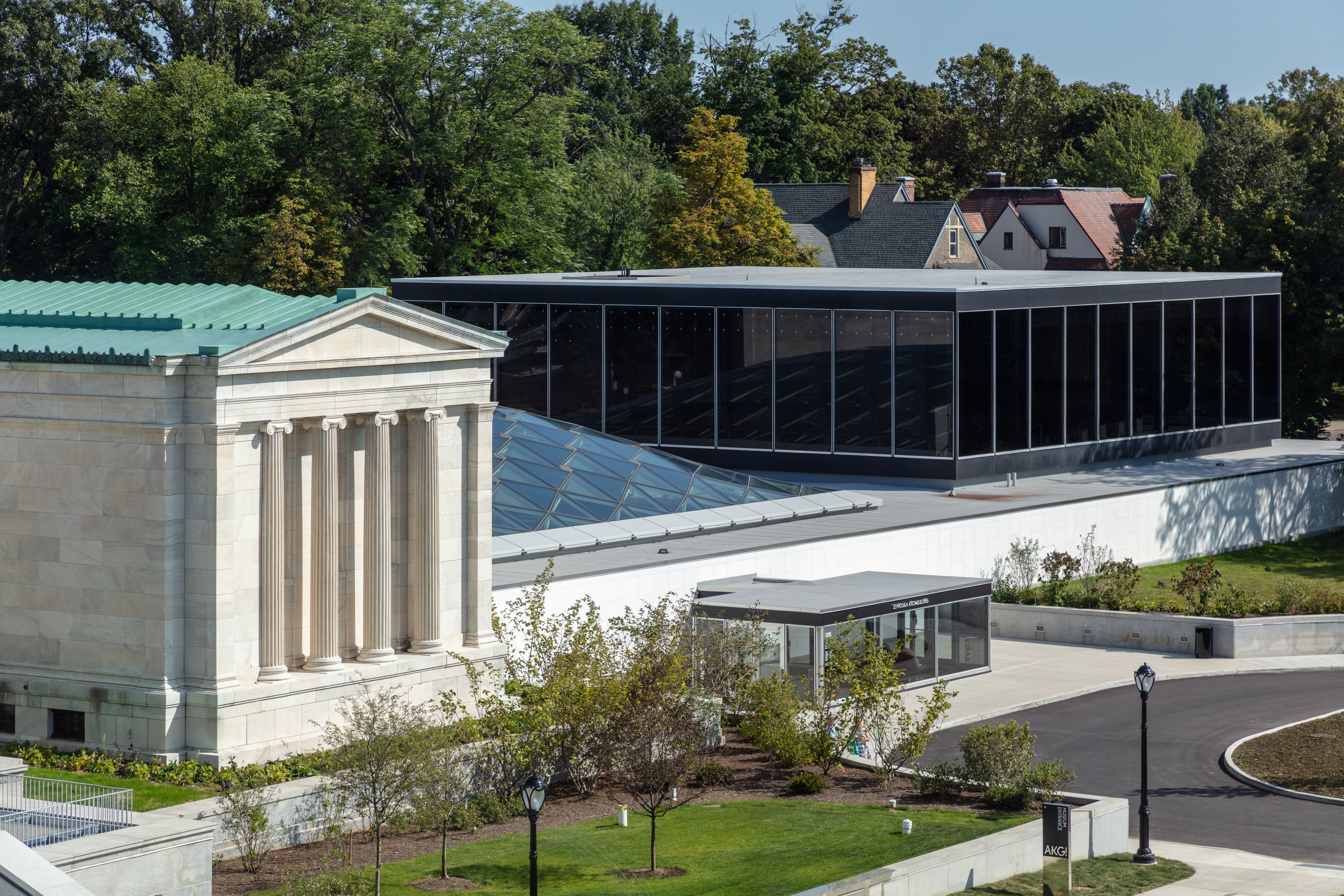 Aerial view of a museum building and a building with a glass canopy roof