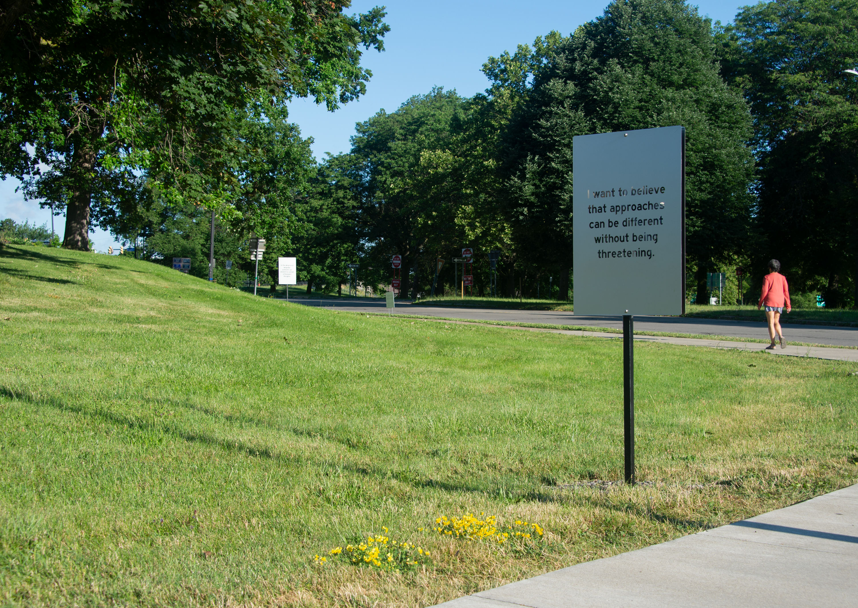 A frosted sign that reads "I want to believe that approaches can be different without being threatening."