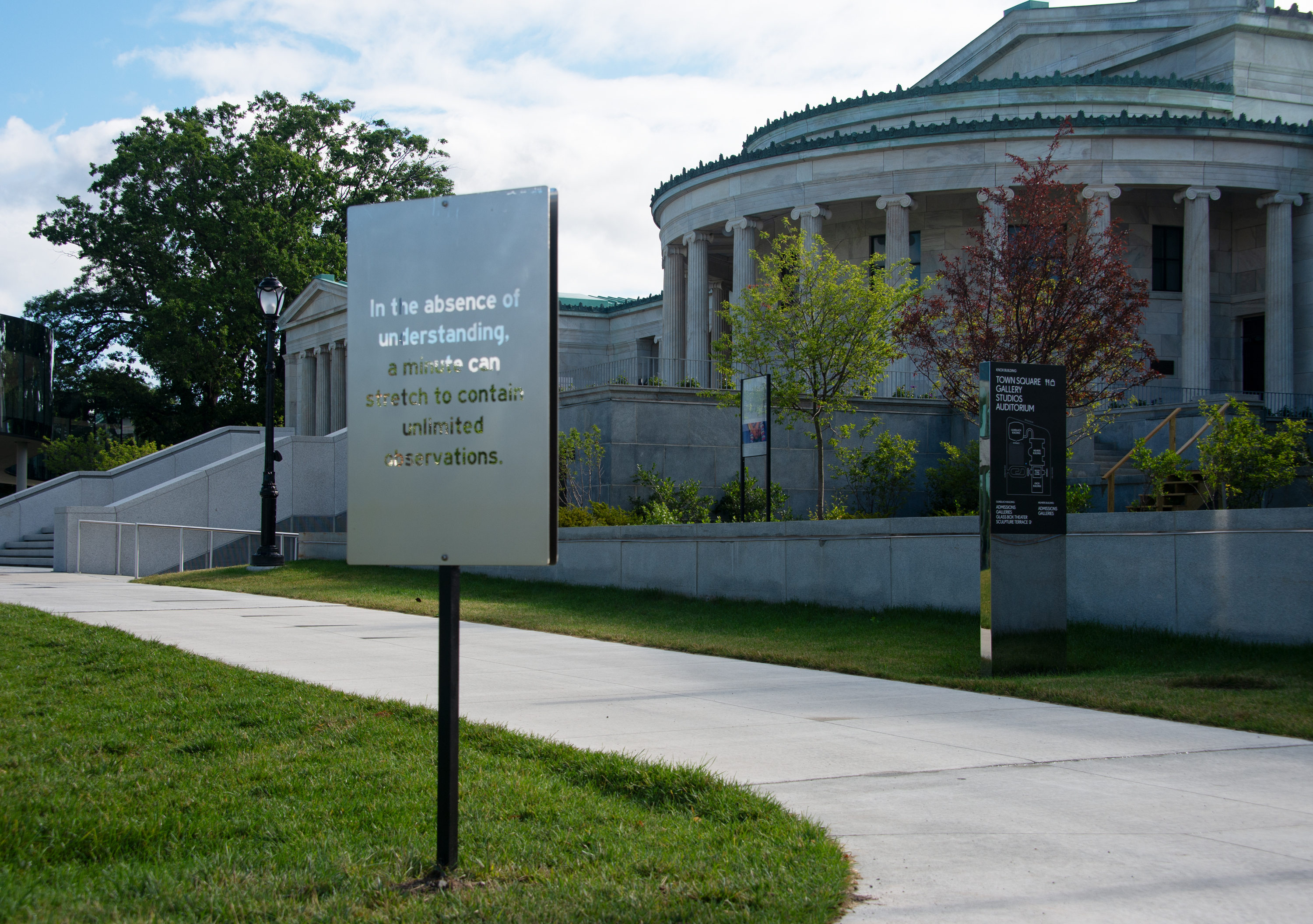 A frosted sign that reads "In the absence of understanding, a minute can stretch to contain unlimited observations."