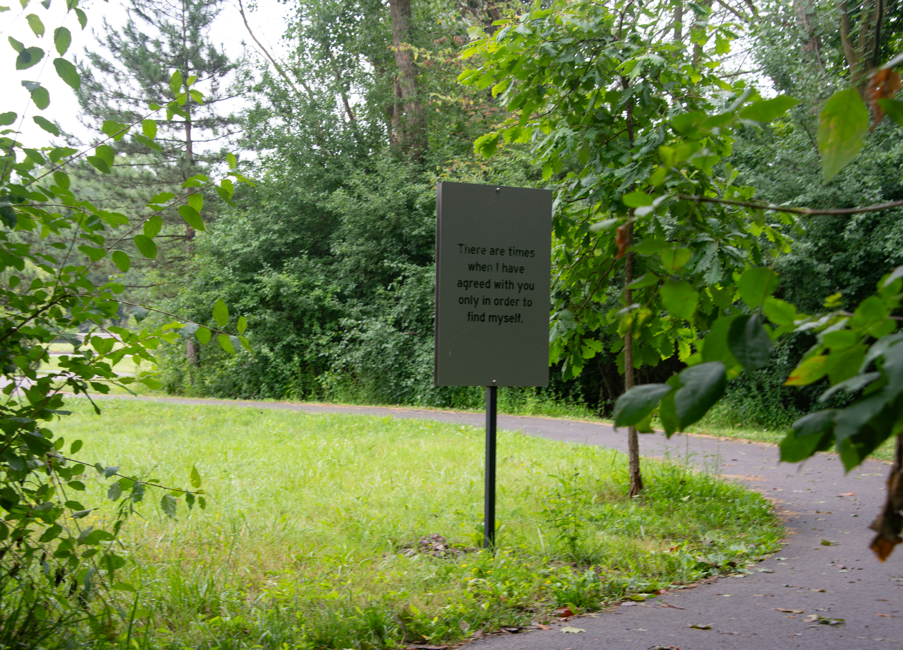 A sign that reads "There are times when I have agreed with you only in order to find myself. "