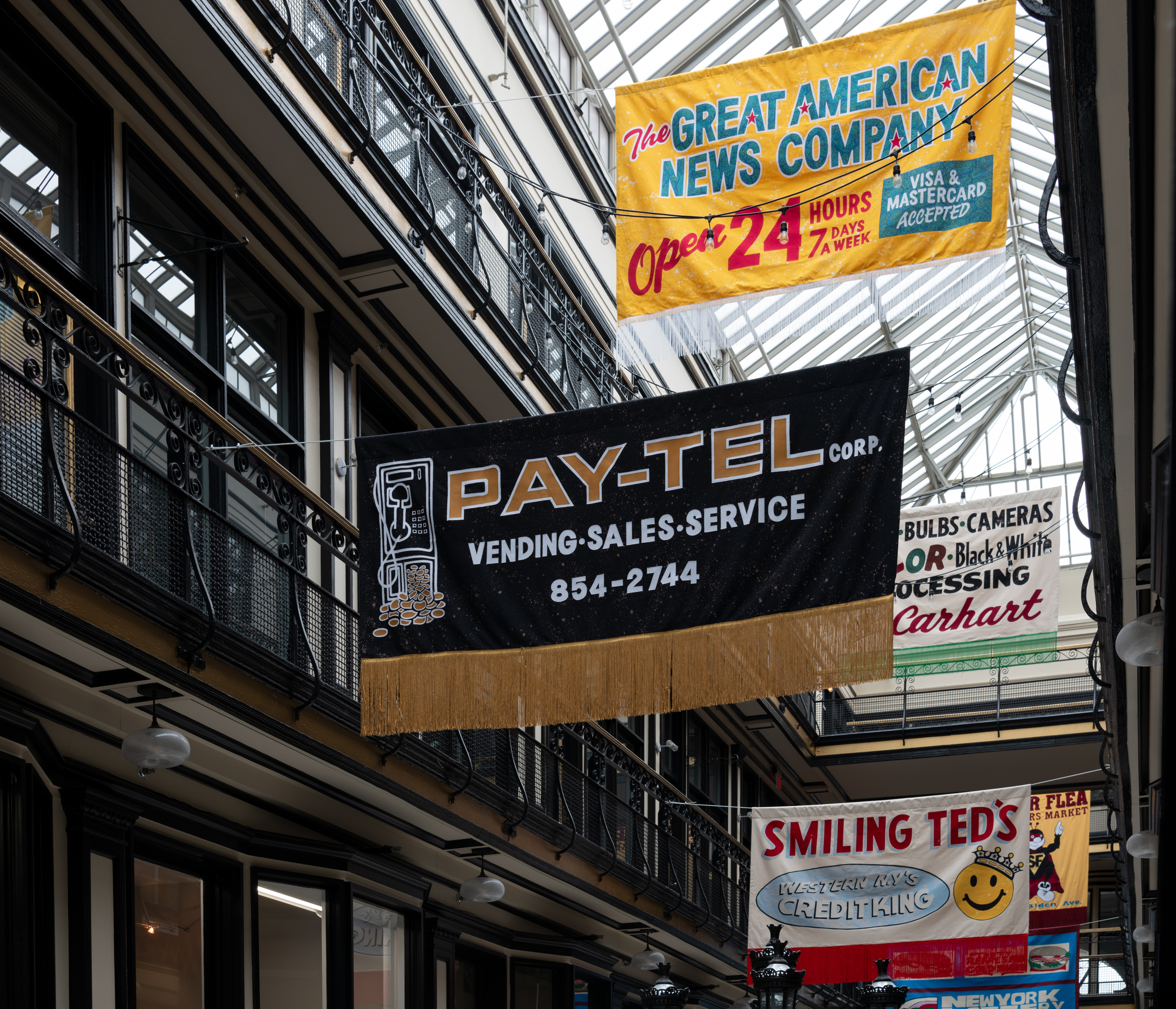 Vintage sign-inspired banners hanging in an industrial building