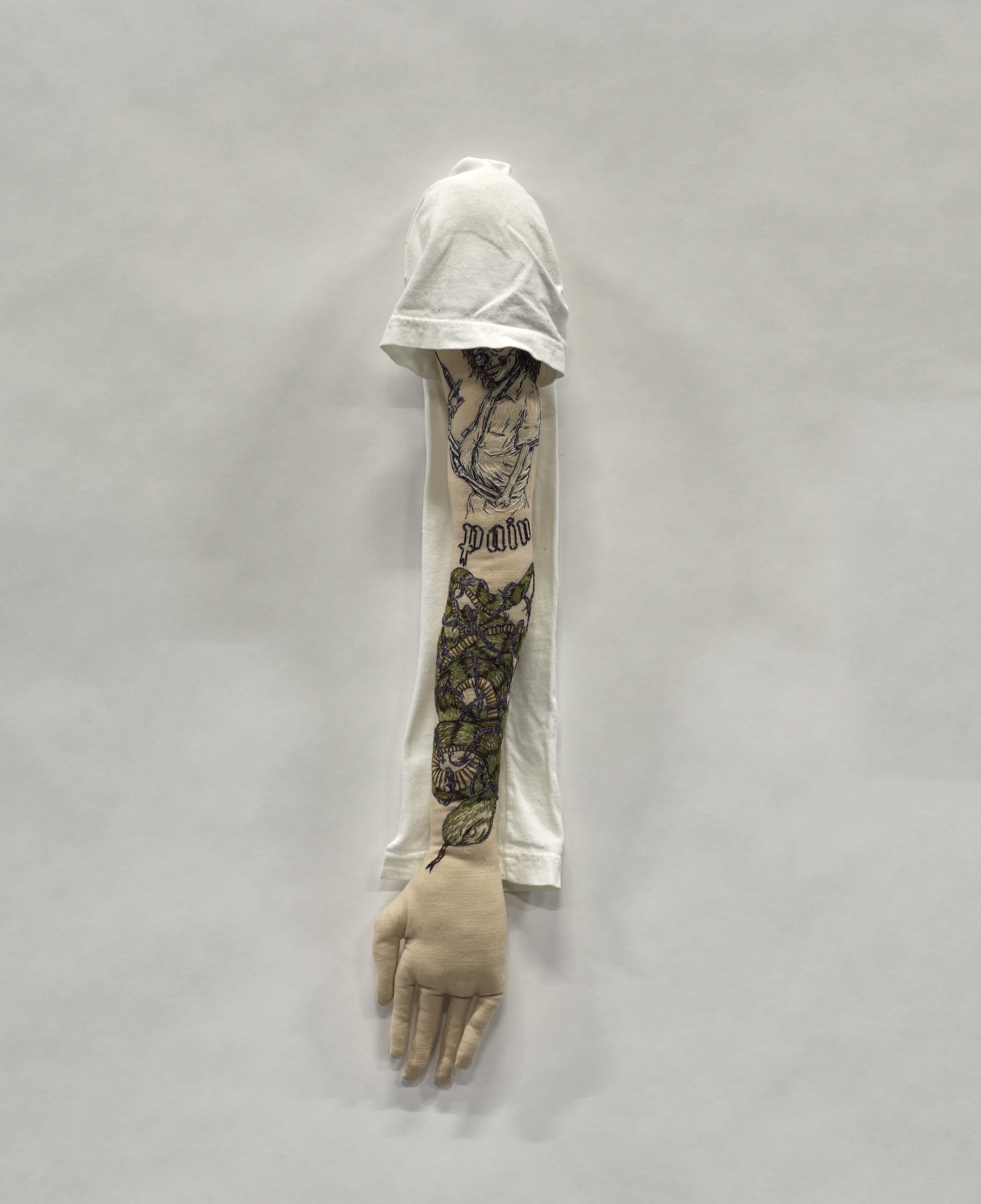 Embroidered artwork that resembles a tattooed arm