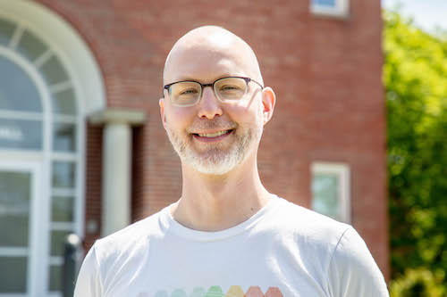 Photograph of man of light skin tone seen from shoulders up