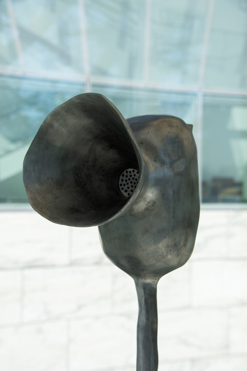 Close up of a statue that resembles a megaphone that produces sound
