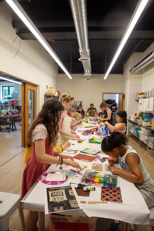 Students working on art projects in a studio