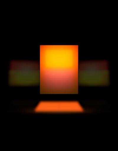 Glowing orange and yellow rectangle floating in the middle of a black background 