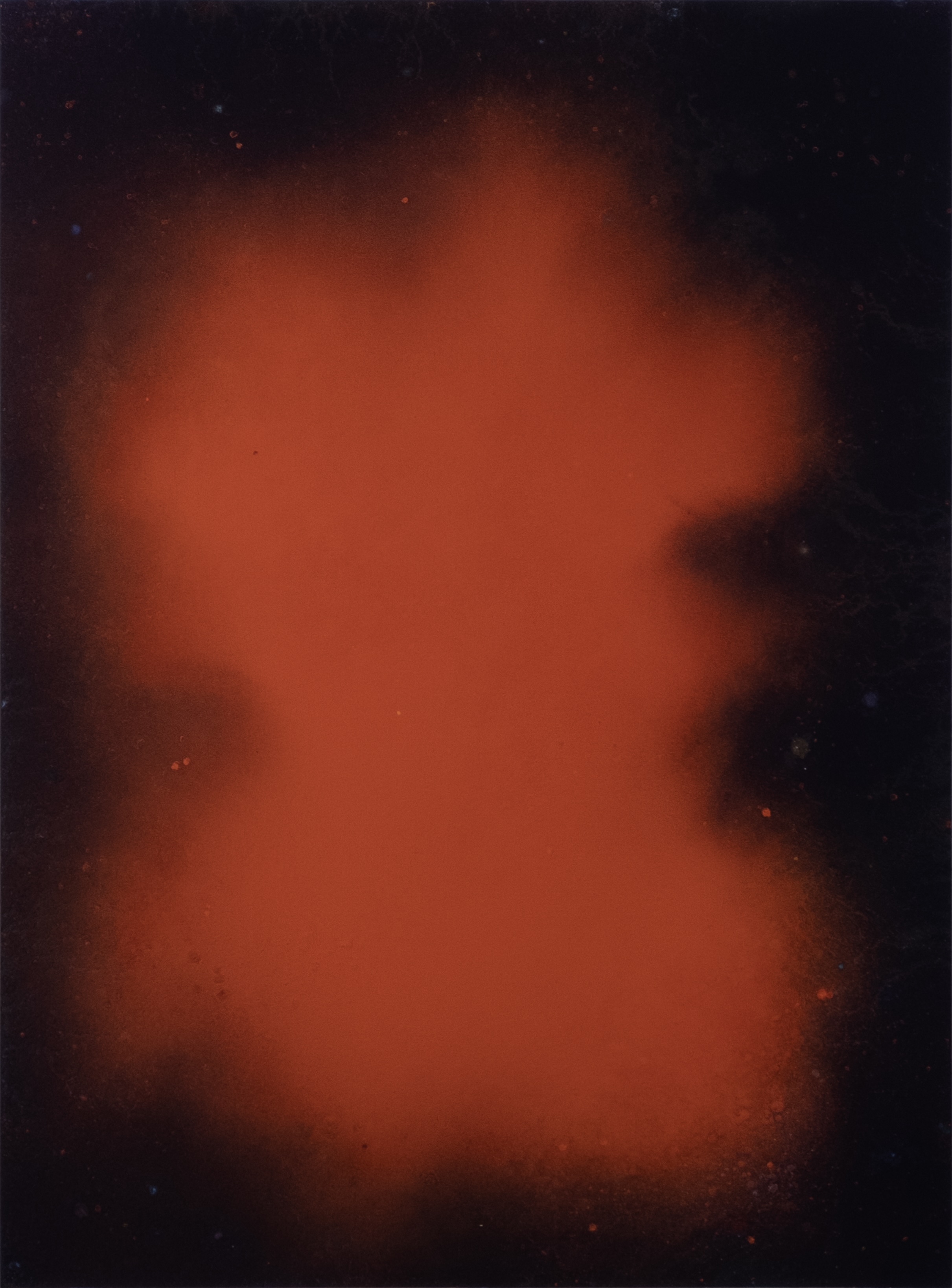 Abstract expressionist painting in a bright red center with black around the perimeter