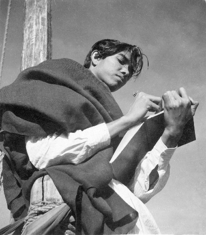 Black and white image of a young person sketching