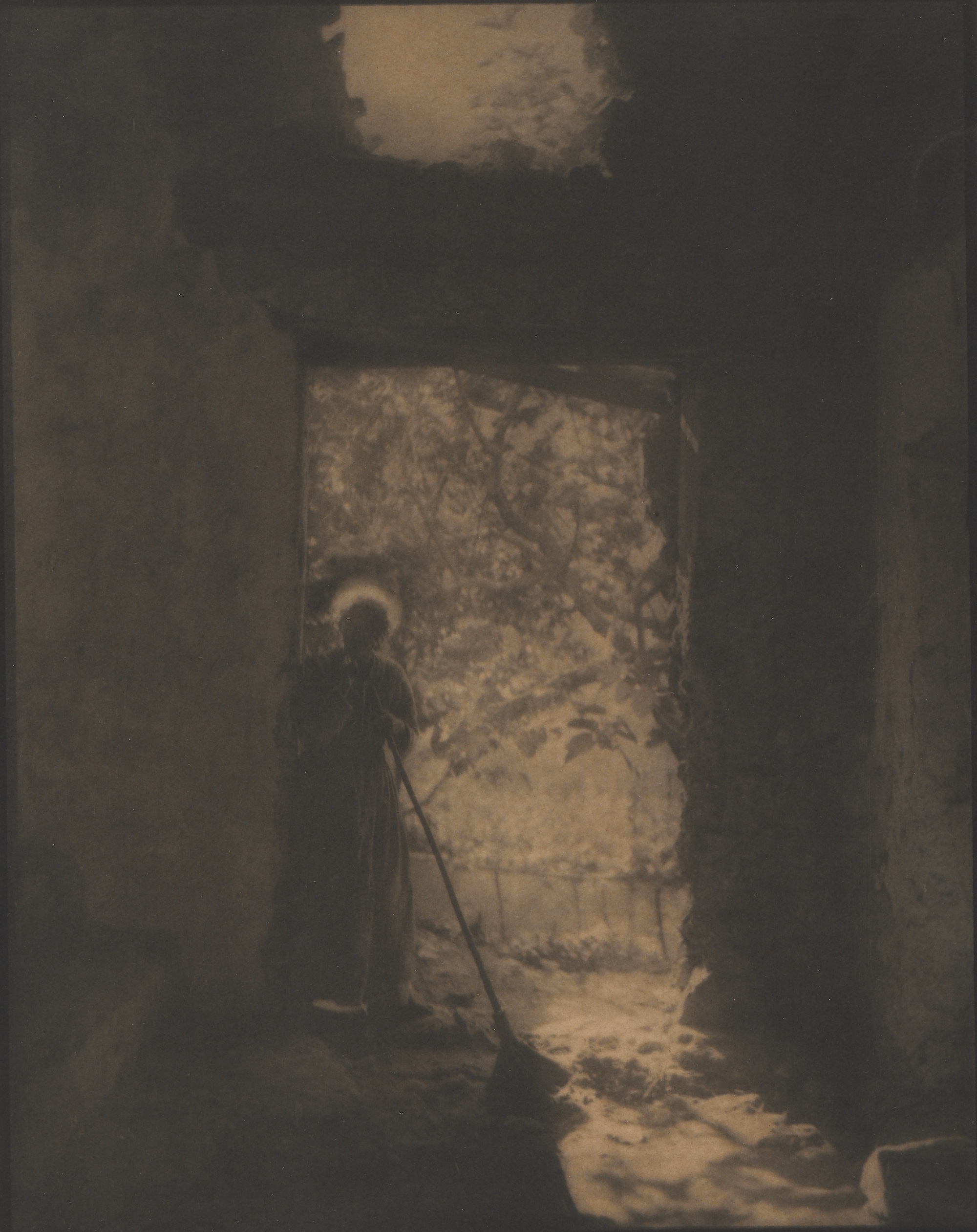 Sepia-toned photograph shows a woman standing in a darkened doorway, the world beyond illuminated