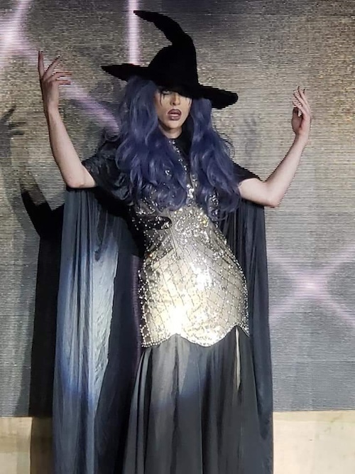A person dressed in a witch costume