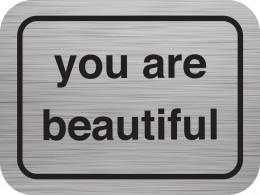 Silver sticker that says "You Are Beautiful"