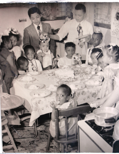 Black and white photograph showing a birthday celebration