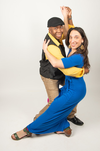 A man and woman posing in a salsa dance move