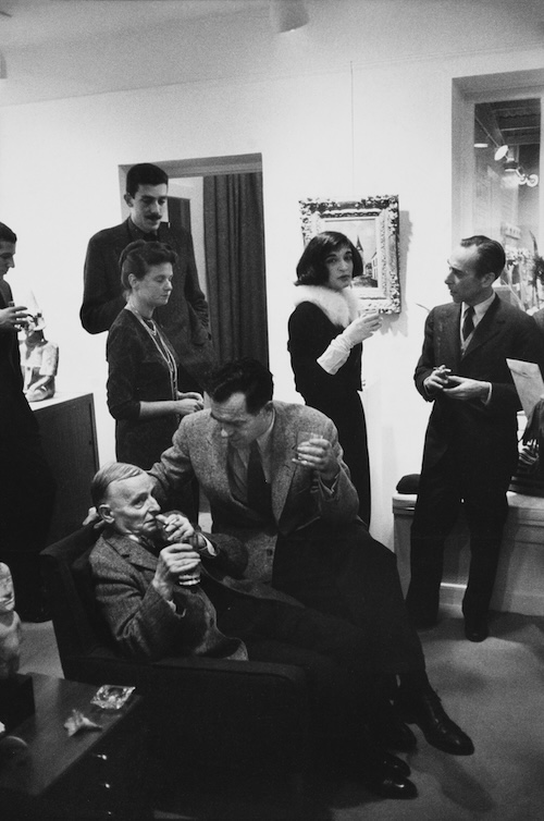 A black and white image of a cocktail party