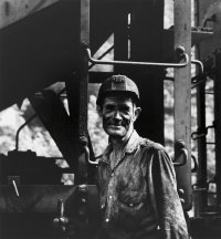 Untitled (Miner next to coal cars) from the series Appalachia, 1962-1987