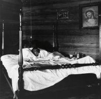 Untitled (Black woman in bed) from the series Appalachia, 1962-1987