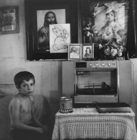 Untitled (Seated boy next to record player) from the series Appalachia, 1962-1987