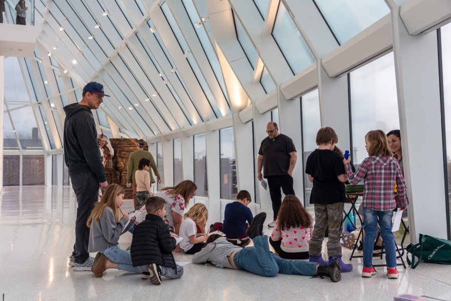 A group of children on a floor coloring