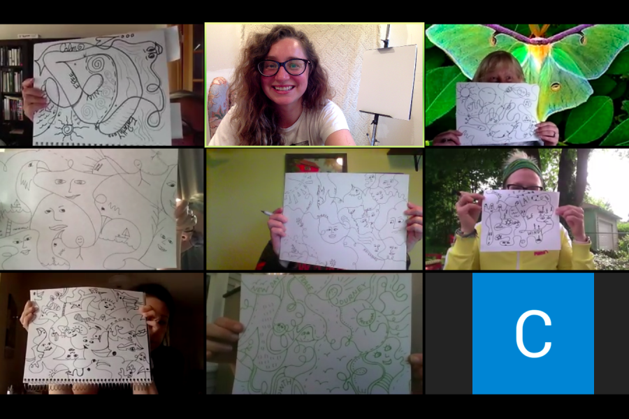 A grid of nine people holding up drawings