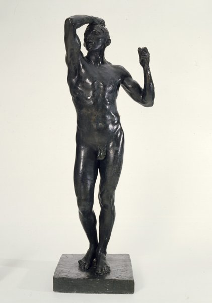 This life-sized, muscular nude is captured as if in mid-stride, with his right hand raised to clasp his scalp and his left hand raised in a fist. His mouth is open, and his facial features contorted in what appears to be pain or anger.