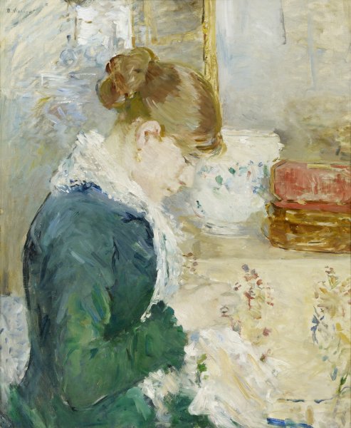 The profile of a young woman bent intensely over the sewing work she holds in her hands fills the foreground of this portrait-oriented painting. Her caramel-colored hair is pulled back from her face in a bun, and she wears a dark green dress topped with a white lace shawl. In the background, a white urn and a wooden box open to reveal its red interior sit on top of a table covered in a cream colored and floral patterned cloth.