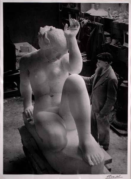 Maillol finishing his large sculpture "La Montagne" in the studio of Van Dongen Dec. 21, 1936
