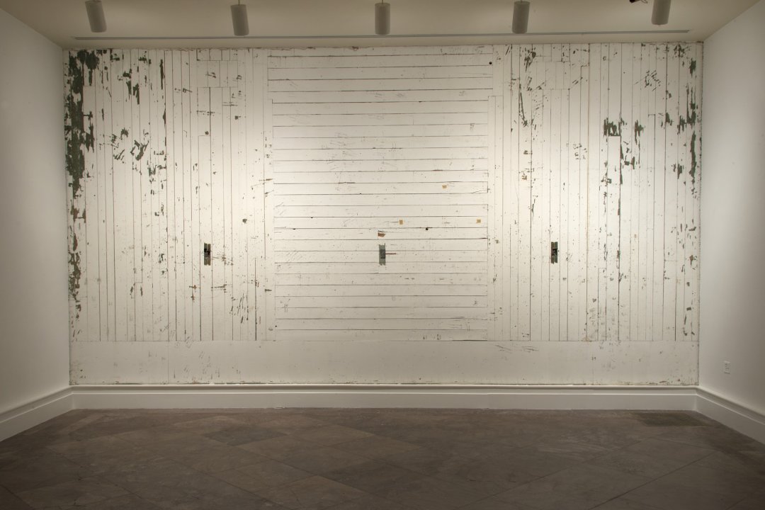 A WALL STRIPPED OF PLASTER OR WALLBOARD