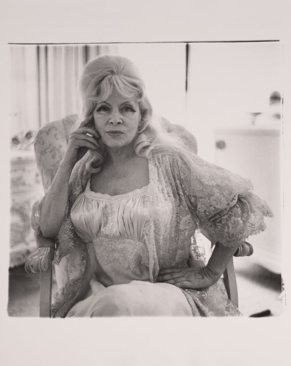 Mae West in a chair at home, Santa Monica, California