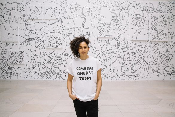 Shantell Martin in front of her mural in the Albright-Knox's Sculpture Court