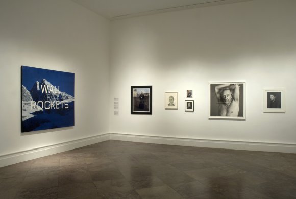 Installation view of WALL ROCKETS: Contemporary Artists and Ed Ruscha with Ruscha's WALL ROCKETS, 2000, on the left
