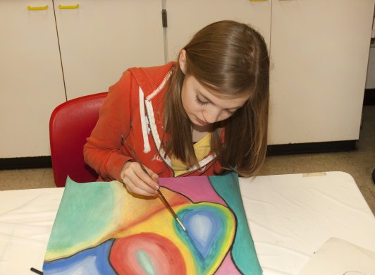 Photo of child making artwork