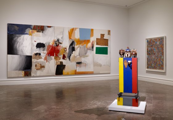 From left: Robert Rauschenberg’s Ace, 1962, Marisol's Tea for Three, 1960; and Jasper Johns’s Numbers in Color, 1958–59, on view in Giant Steps: Artists and the 1960s