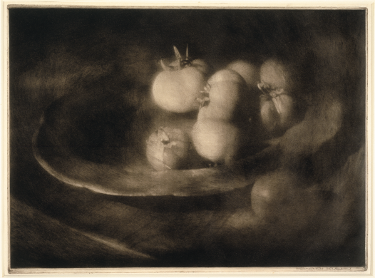 Old sepia-toned photograph of a bowl of tomatoes 