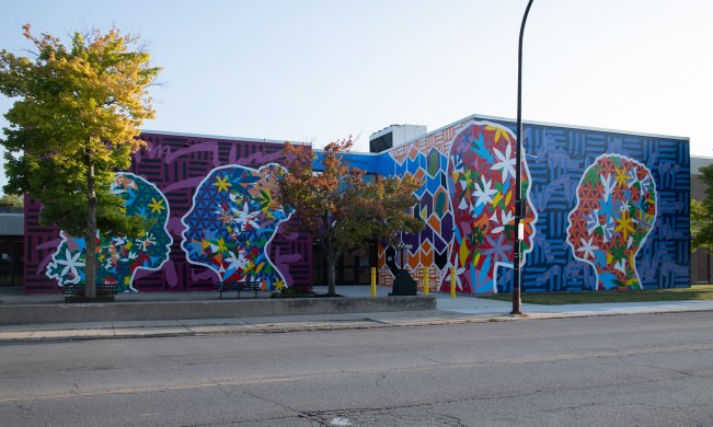 A vibrant mural of profiles 