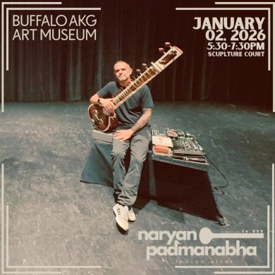 A man holding a sitar