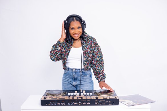 A DJ smiling at the camera