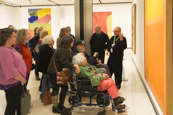 Guests on a tour in front of Mark Rothko's Orange and Yellow