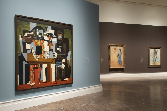 Installation view of Picasso: The Artist and His Models, with Picasso's Three Musicians, 1921; La toilette, 1906; and Bather, winter 1908–09