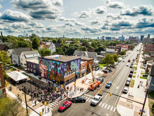 erial view of the community dedication celebration for Betsy Casañas's mural