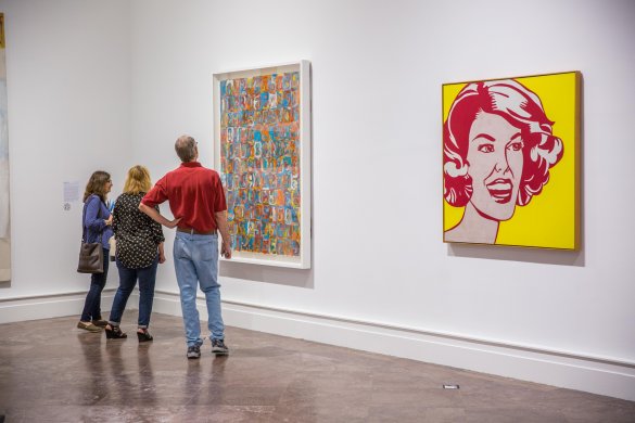 Visitors with Jasper Johns's Numbers in Color, 1958–59, and Roy Lichtenstein's Head—Red and Yellow, 1962, in Giant Steps: Artists and the 1960s