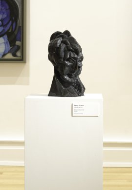 A bronze sculpture of a woman's head