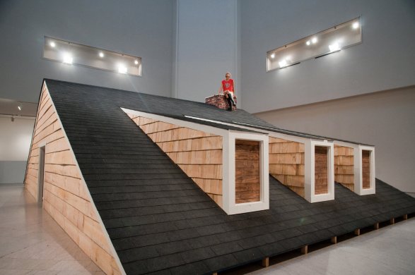 A rooftop of a house built inside a large room