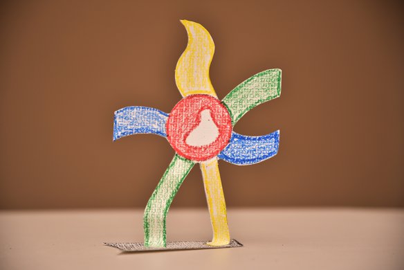 A paper sculpture of a walking flower