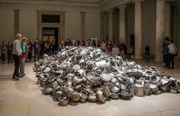 Guests around Subodh Gupta's This is not a fountain, 2011–13, in We the People: New Art from the Collection