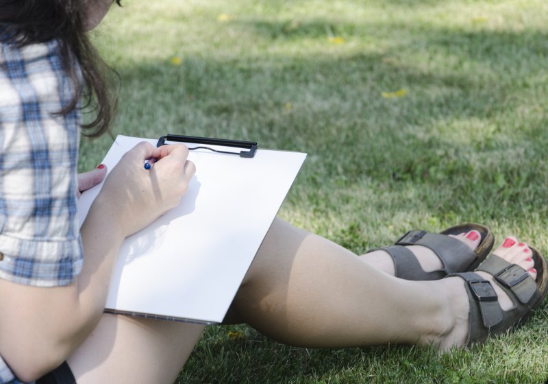 A young woman working on a drawing