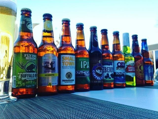 Bottles of beer lined up on the bar in AK Cafe