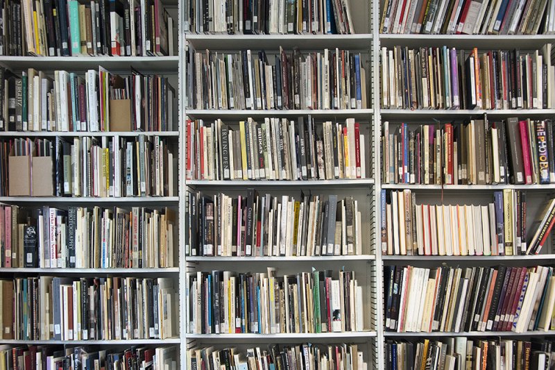 Books on shelves in the G. Robert Strauss, Jr. Memorial Library