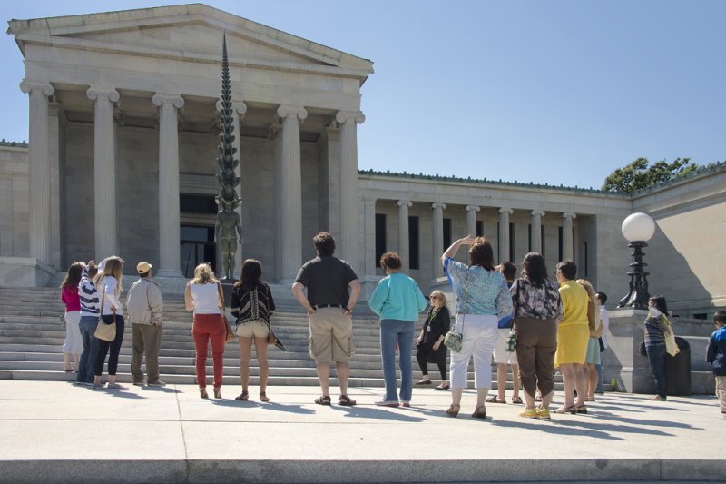 People on a tour around Do Ho Suh's Karma on the museum's Delaware Stairs