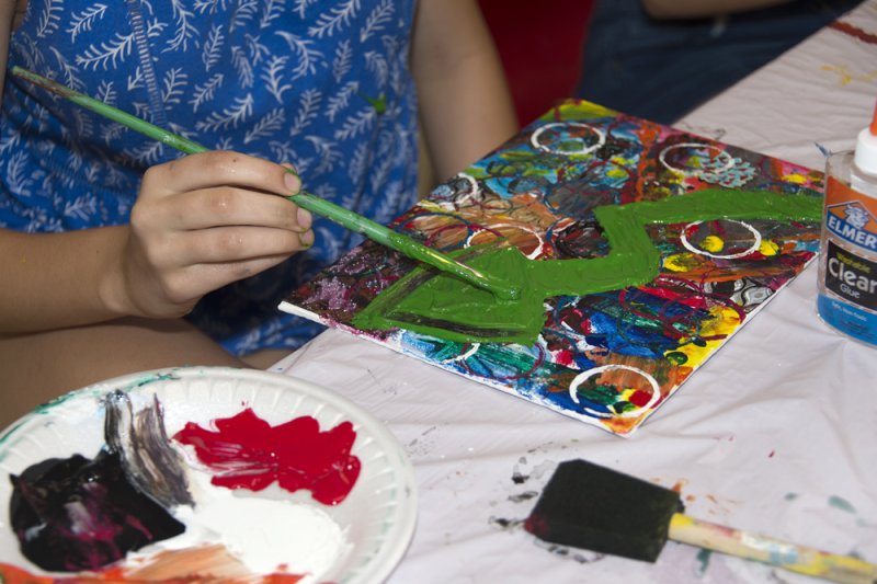 Photo of child making artwork