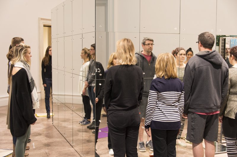 Guests meditate around Lucas Samaras's Mirrored Room, 1966